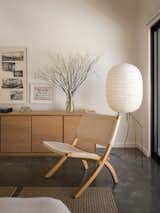 A Hans Wagner Rope Chair, West Elm credenza, and Noguchi Akari UF3-DL Standing Lamp round out the primary bedroom.