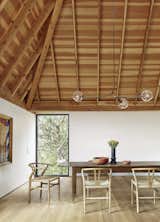 Dining Room, Light Hardwood Floor, Pendant Lighting, Chair, and Table  Photo 6 of 17 in Cor-Ten Steel Cloaks a Set of Four Structures That Form a Texas Home