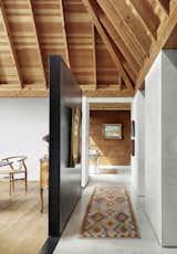 Hallway, Concrete Floor, and Rug Floor  Photo 4 of 17 in Cor-Ten Steel Cloaks a Set of Four Structures That Form a Texas Home