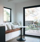 Additional storage hidden under the breakfast nook bench helps maximize every square inch. 