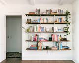 The bookshelf system is from Modern Shelving with stained boards from Lowe’s. 