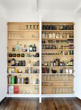 At 1,026 square feet, being conscious of clutter can be particularly pertinent. Small storage hacks, like this tidy spice and wine rack in the kitchen, save time and repeated headaches in the long run. 
