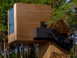 Exterior, Wood Siding Material, Flat RoofLine, Prefab Building Type, Cabin Building Type, Tiny Home Building Type, Metal Siding Material, and Glass Siding Material  Photo 3 of 16 in Gravity’s No Match for This Cantilevered Cabin in Estonia