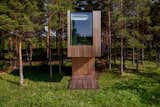 Exterior, Metal Siding Material, Cabin Building Type, Tiny Home Building Type, Wood Siding Material, Flat RoofLine, and Glass Siding Material  Photo 1 of 16 in Gravity’s No Match for This Cantilevered Cabin in Estonia