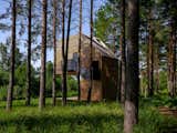 Exterior, Flat RoofLine, Wood Siding Material, Cabin Building Type, Metal Siding Material, Prefab Building Type, Tiny Home Building Type, and Glass Siding Material  Photo 4 of 16 in Gravity’s No Match for This Cantilevered Cabin in Estonia