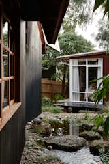 A Pair of Backyard Cabins Are Worlds Removed From Their Main Residence—But Only Steps Away - Photo 6 of 22 - 