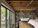 A Wall of Books Puts the Finishing Touch on This Rough-Hewn Backyard Home in Austin