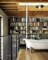 A Wall of Books Puts the Finishing Touch on This Rough-Hewn Backyard Home in Austin - Photo 13 of 17 - 