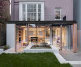A Glass-Wrapped Extension Brings a Touch of California Modernism to This London Backyard