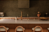 Carlos and Whitney went with a Roman Clay from Portola paints for the kitchen backsplash. Compared with the lime wash used throughout the house, roman clay is easier to clean.