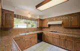 Before: Despite the kitchen receiving a major overhaul, Carlos and Whitney liked its larger size.  Photo 17 of 29 in Before & After: This Suburban L.A. Home’s Most Attractive Quality? A Near Complete Lack of Character