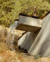 Snow melt accumulated during the winter months drains off the roof to one side of the home with the help of an integrated scupper.