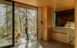 GO’C finished the 330-square-foot interiors in maple plywood, creating storage in as many places as possible for Catherine to store clothes and outdoors gear.