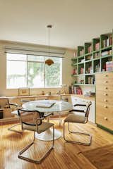 The couple are also design lovers, particularly when it comes to vintage furniture. The study is furnished with a Saarinen Table by Knoll and Thonet Cantilever Chairs.