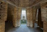 The sculptural brick hammam has a hot tub, steam room, rain shower, and cold plunge.