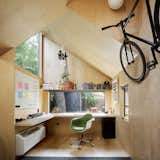 Despite its small footprint, the flexible, multi-purpose space includes bike storage and a niche for storing weights.