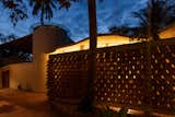 Recycled Roof Shingles Become a Textured Fence For a Curved Home in India - Photo 15 of 15 - 