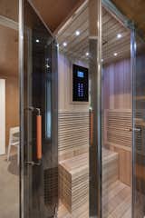 While the couple splurged on Michael's dream steam shower and sauna from Aquapeutics, they saved elsewhere by opting for Ikea cabinets and Caesarstone countertops in the kitchenette.