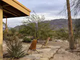 The property is pulled off from the highway with Joshua Tree in the distance. “The house is completely silent,” says Jessica. “I sleep differently here.”