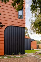 Mahogany House by R Architecture in Melbourne, Australia, is clad in locally made terra-cotta shingles.