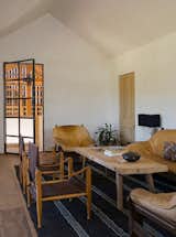 Inside the loft, the antique hardwood floors add a layer of character thanks to their uneven planks and varied tones.