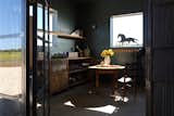 The two chairs in the feed room are family heirlooms that first belonged to Kelli’s grandfather. He had them in what he called his rest space, which referred to the small cabin on their family’s farm in Burleson County, Texas. 