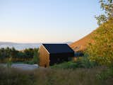 An Icelandic Cabin’s Pitched Roof Mirrors the Mountain Behind It