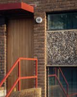 Red Steel and Brick Enliven a ’70s Rowhouse Renovation in London - Photo 2 of 15 -