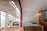 Red Steel and Brick Enliven a ’70s Rowhouse Renovation in London - Photo 3 of 15 -