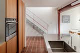 Red Steel and Brick Enliven a ’70s Rowhouse Renovation in London - Photo 4 of 15 -