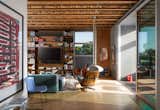 The home has high ceilings and large sliders that extend the living areas outdoors.