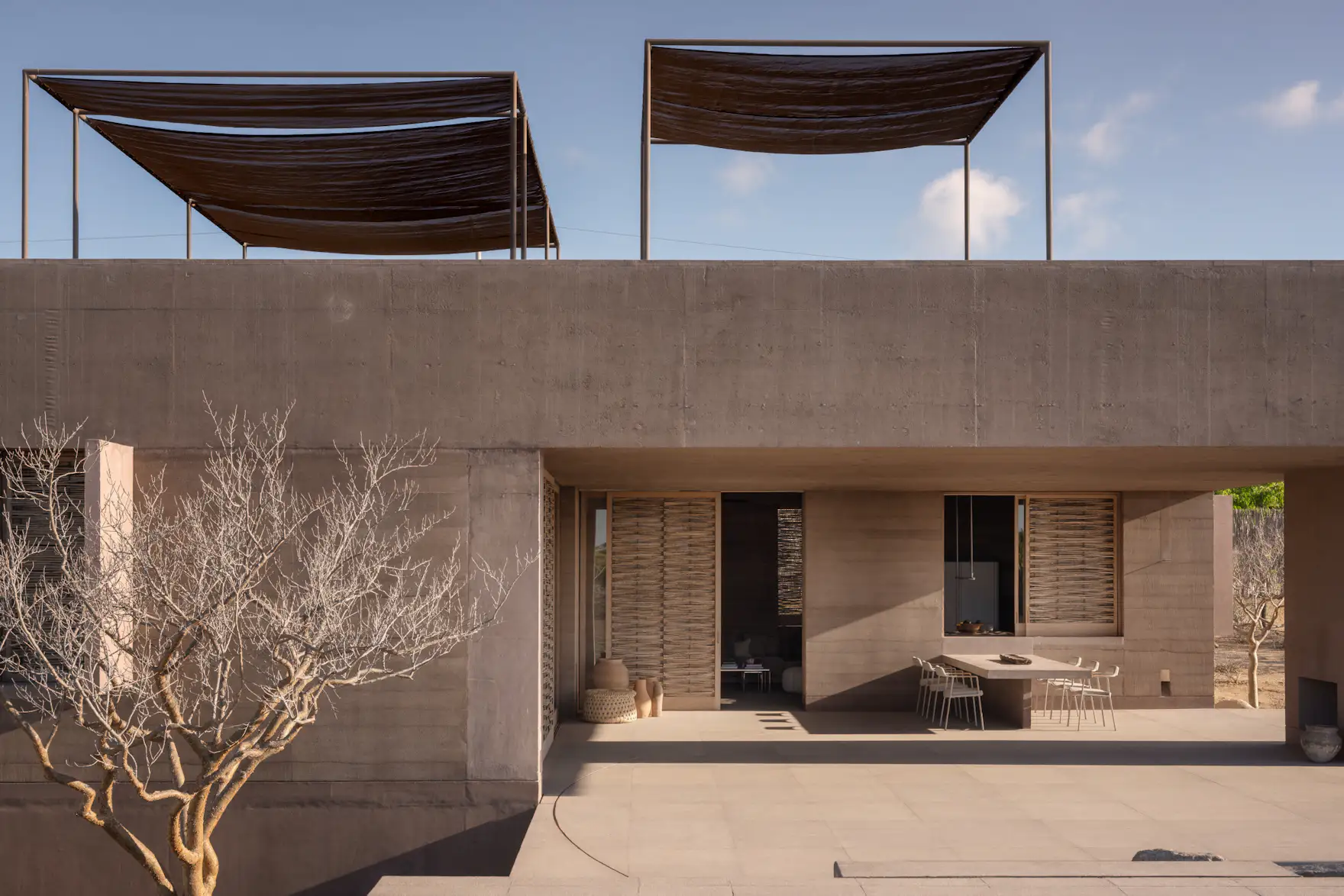 Photo 4 of 15 in A Dusty-Pink Rammed Earth Home Appears to Rise Out of ...