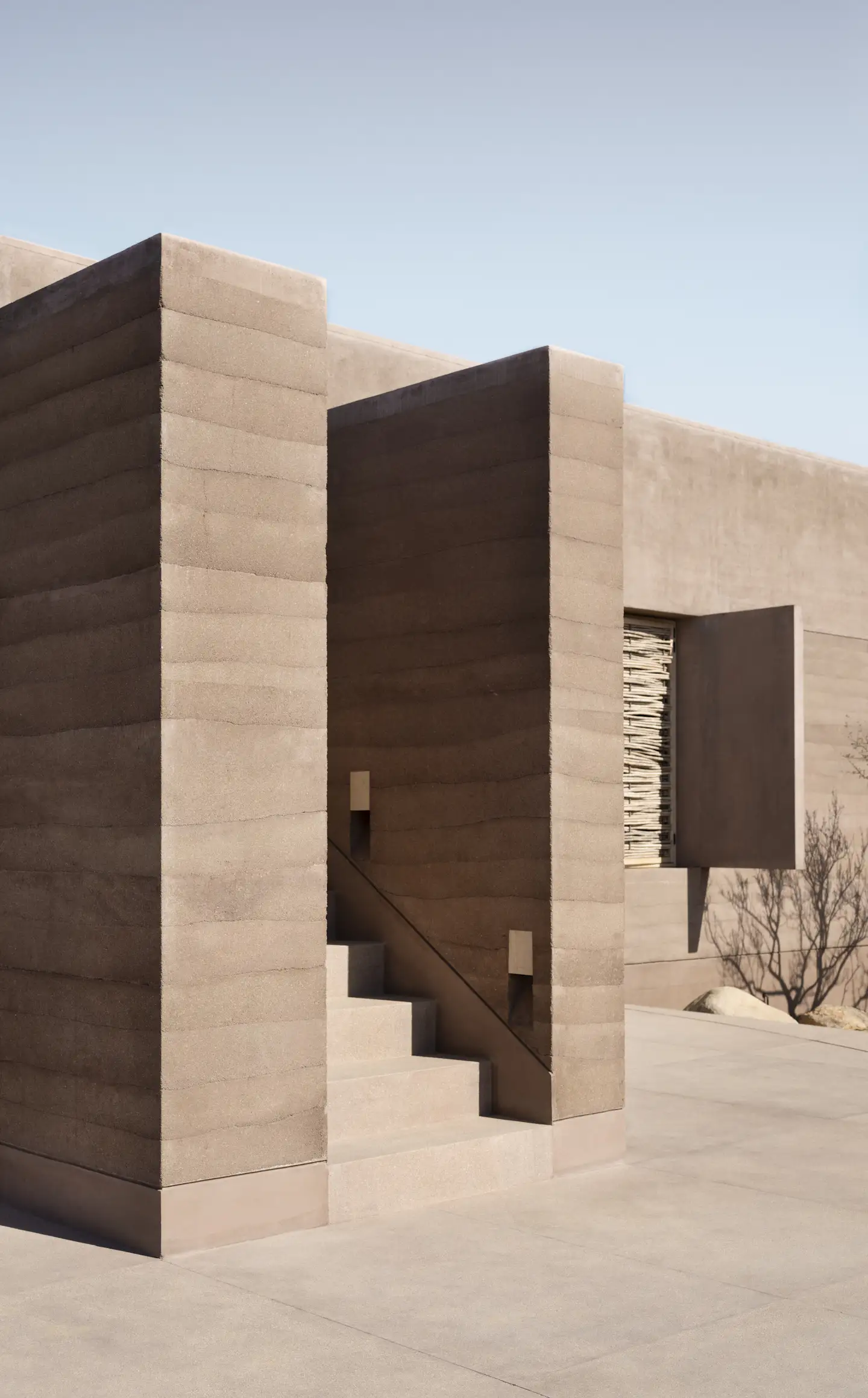 Photo 3 of 15 in A Dusty-Pink Rammed Earth Home Appears to Rise Out of ...