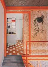 A Framework of Orange and Green Steel Reorganizes a Madrid Home for a Family of Four - Photo 7 of 15 - 