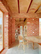 In winter, a wood-fired stove keeps the entire house warm. “I love when people come over in the middle of winter and find out there is no extra heating,” says Jordi. It’s the final surprise in a home full of quiet, thoughtful ones.