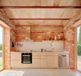The kitchen cabinetry is custom made by Fusteria Jaume Olive SL.