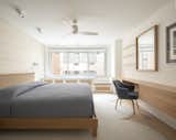 In the two bedrooms and the living room, custom built-in pieces below the windows creatively conceal the HVAC units while adding storage.&nbsp;&nbsp;