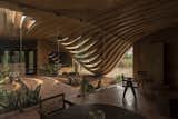 A Wave of Concrete Ribbons Forms a Courtyard at This Home in India - Photo 5 of 12 - 