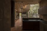 A Wave of Concrete Ribbons Forms a Courtyard at This Home in India - Photo 8 of 12 - 
