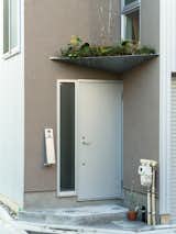 Small House on a Corner Lot by KOMINORU Design