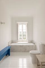 One of the apartment’s many windows overlooks an alcove tub.&nbsp;