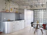 The Loft in This Madrid Flat Hangs From the Ceiling With a Metal Truss
