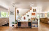 Another standout feature for Nathaniel is the custom staircase, with its exposed wood edging that steps down the wall in a zigzag rhythm.