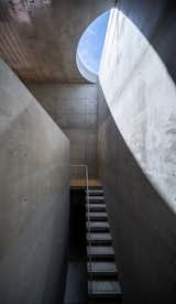 Half-Moon Cutouts Cast Dramatic Light Across This Concrete Home in Tokyo - Photo 13 of 16 - 