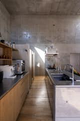 Half-Moon Cutouts Cast Dramatic Light Across This Concrete Home in Tokyo - Photo 7 of 16 - 