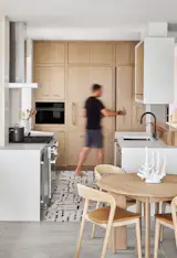 New custom cabinetry in the kitchen grants space for packed weekends with shared family meals.