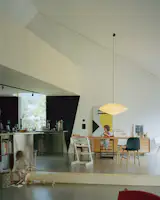 Red Piping Punches Up a Liechtenstein Home Split Into Two Units - Photo 8 of 11 - 