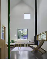 The cabin officially has 2 beds and 2 baths, but with a custom bed-width sofa and a convertible reading loft, it can technically swell to four bedrooms.