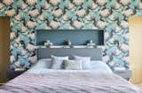 The primary bedroom's botanic wallpaper is by Osborne &amp; Little.
