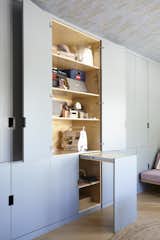 Additional built-in storage and enlarged closets appear throughout the renovation.